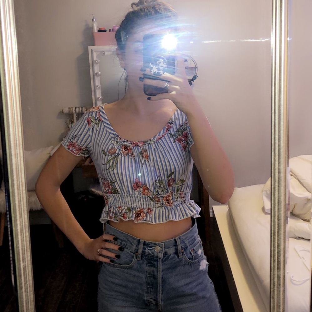 This is a crop top, white, blue, floral!